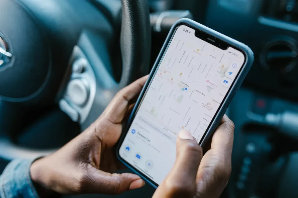 A person holding a smartphone with a map application open, symbolizing navigation challenges linked to a wrong tour guide.